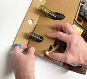 Hole in an expanded panel being placed over a bottle neck